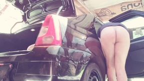 naked man cleaning car