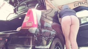 naked man cleaning car
