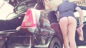 naked man cleaning car