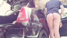 naked man cleaning car