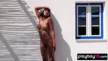 Asian babe squeezes orange on her perky tits