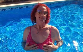 Just me, in a bikini, splashing about in a pool on holiday in Spain