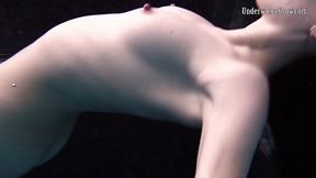 Naked babe, Alla Birtakik is performing under water and often spreading up to display her pussy