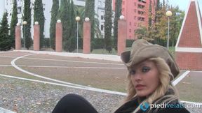 Beautiful Christelle showing nylon feet outdoors