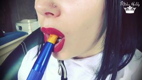 Smoke from dark red big lips