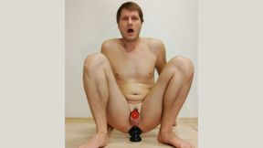 Boris Luptak riding huge dildo caged