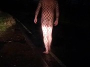 Fishnet bodysuit outside with passing car