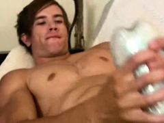 Sexy gay boy filmed close-up while testing his new toy