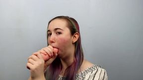 Amateur girl practices sloppy blowjobs on a dildo