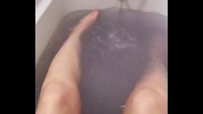 Enjoying the feeling of the warm water rushing between my toes as I relax in the bath