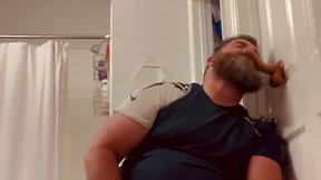 Bearded bear playing with dildos and cumming