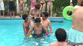 Japanese babes ride big cocks by the pool