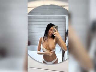 Big titties spilling out whilst she takes the pic