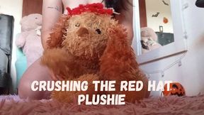 Crushing the red hat plushie