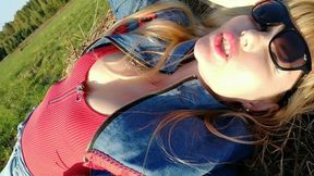 Sunlit Allure: Stunning Blonde Enjoys a Relaxing Day Outdoors