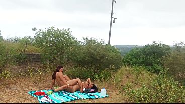 Busty stepmom and curvy stepdaughter enjoy lesbian action in the woods