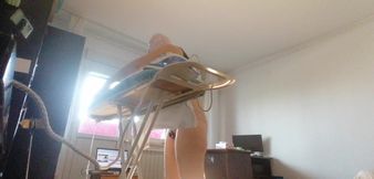 Sexy woman doing naked housework. Brunette, hairy pussy, big ass, big tits. Sexy mom massages herself with a vibrator.
