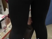 Candid following sexy cougar MILF in tight yoga pants who teases her ass