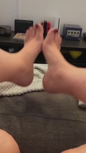 Teasing feet in a foot fetish video