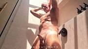 muscle daddy with hairy body playing with his big cock in the shower