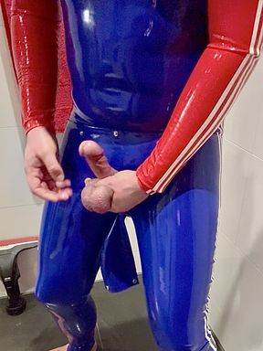 Gay guy jerking off in full rubber latex suit