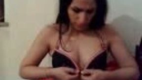 Gorgeous brunette demonstrates her natural tits for the cam