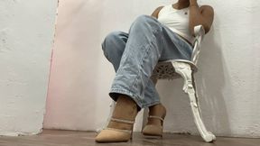 Stiletto heels dangling from a pretty woman's feet (5)