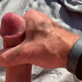 Stroking my hard cock in the field, stay tuned for more!