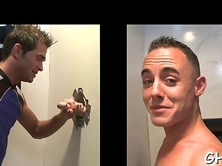 Hot gay blowjob through a hole