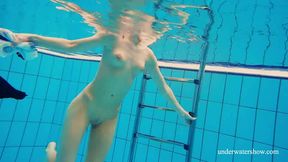 Red haired all horny chick swims underwater in really erotic mode