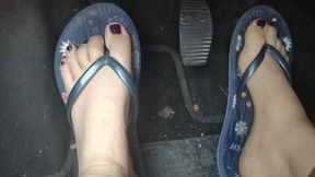 Sweaty feet in really tasty flip flops pedal pumping on the pedals of the car 1080HD