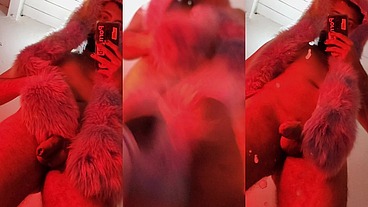 Red fluffy devil with a big uncut cock fills the mirror with cum