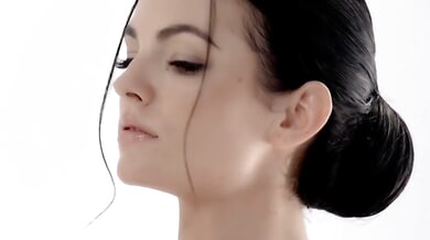 Brunette ballerina explores her pussy in a sleek white studio