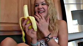 Naughty solo teen chewing on a banana