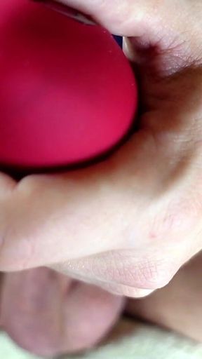 Close-up of Balls Tightening with Red Suction Vibrator