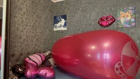 riding on inflatable roll and poping foil balloons