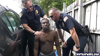 Two police officers take advantages of this black guy