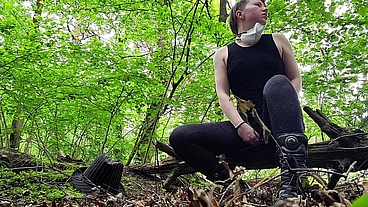 Just a very well stuffed corseted slut playing with a vibrator in the woods....