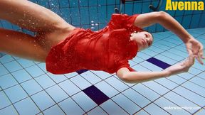 Cute babe in red sexy open dress swimming