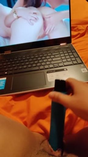 Watching lesbian porn while masturbating my wet pussy