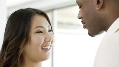 Petie Asian cutie takes a huge black cock in her tight pussy