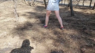 I walk bottomless next to a busy street