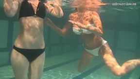 Retro footage of two underwater lesbians