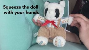 Squeeze the doll with your hands