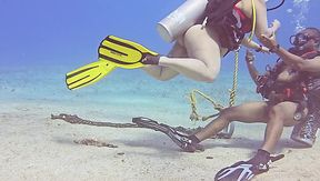Bizzare sex session during SCUBA diving. She takes a huge cock while being 100m underwater