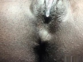 Black cunt stimulated on a sunny day in a close-up shot