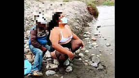 Fat exhibitionist shemale in lingerie masturbates and introduces a bottle in her ass on a public beach