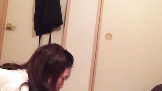 Naughty Japanese teen pees in a cup while putting makeup on