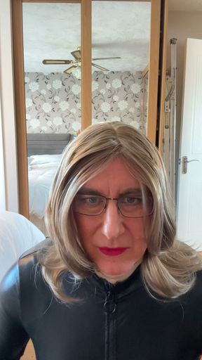 sexy Sissy crossdresser wearing a sexy Black leather playsuit waiting for you to fuck her as she plays with herself.