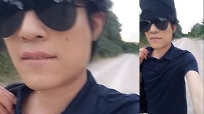 This Asian gay twink has something stuck in his ass and sticking out of his buttocks while he walks in front of everyone